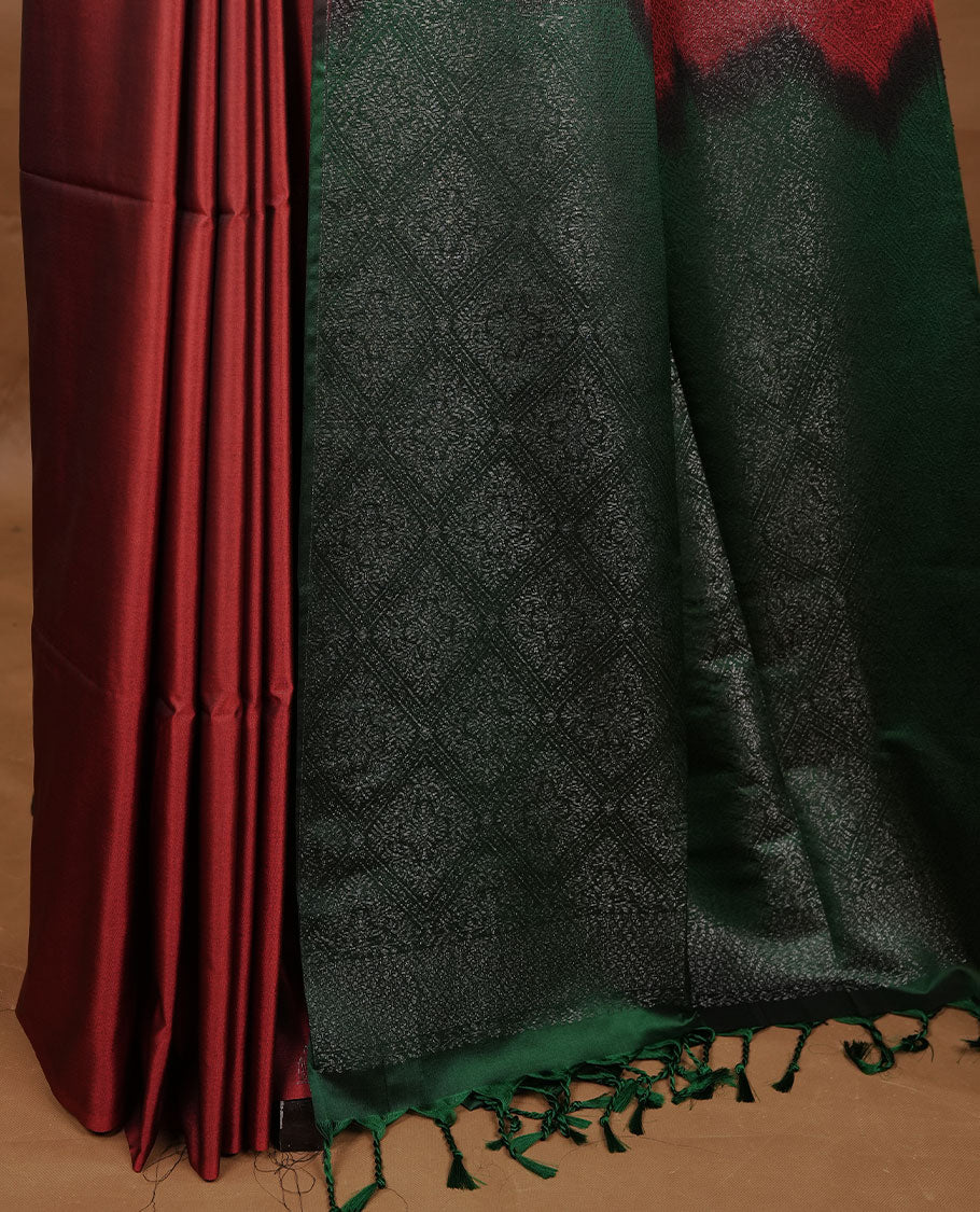 Red colour soft silk saree features a sleek borderless design with intricate antique zari motifs, flowing into a striking contrast green pallu and a matching blouse piece.