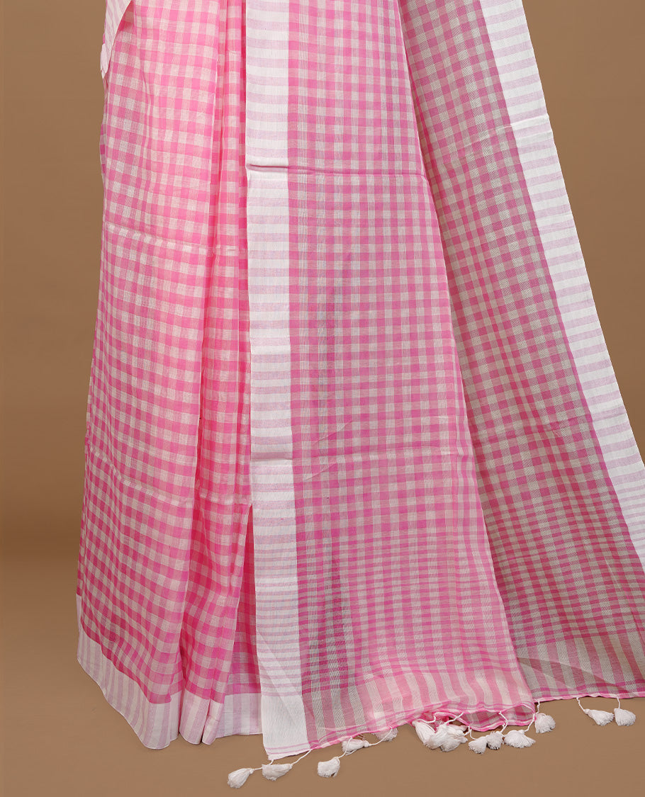 Pink and White colour Mul Cotton saree featuring a classic Big check pattern on the body, accented with tassels for added charm. Comes without a blouse piece.