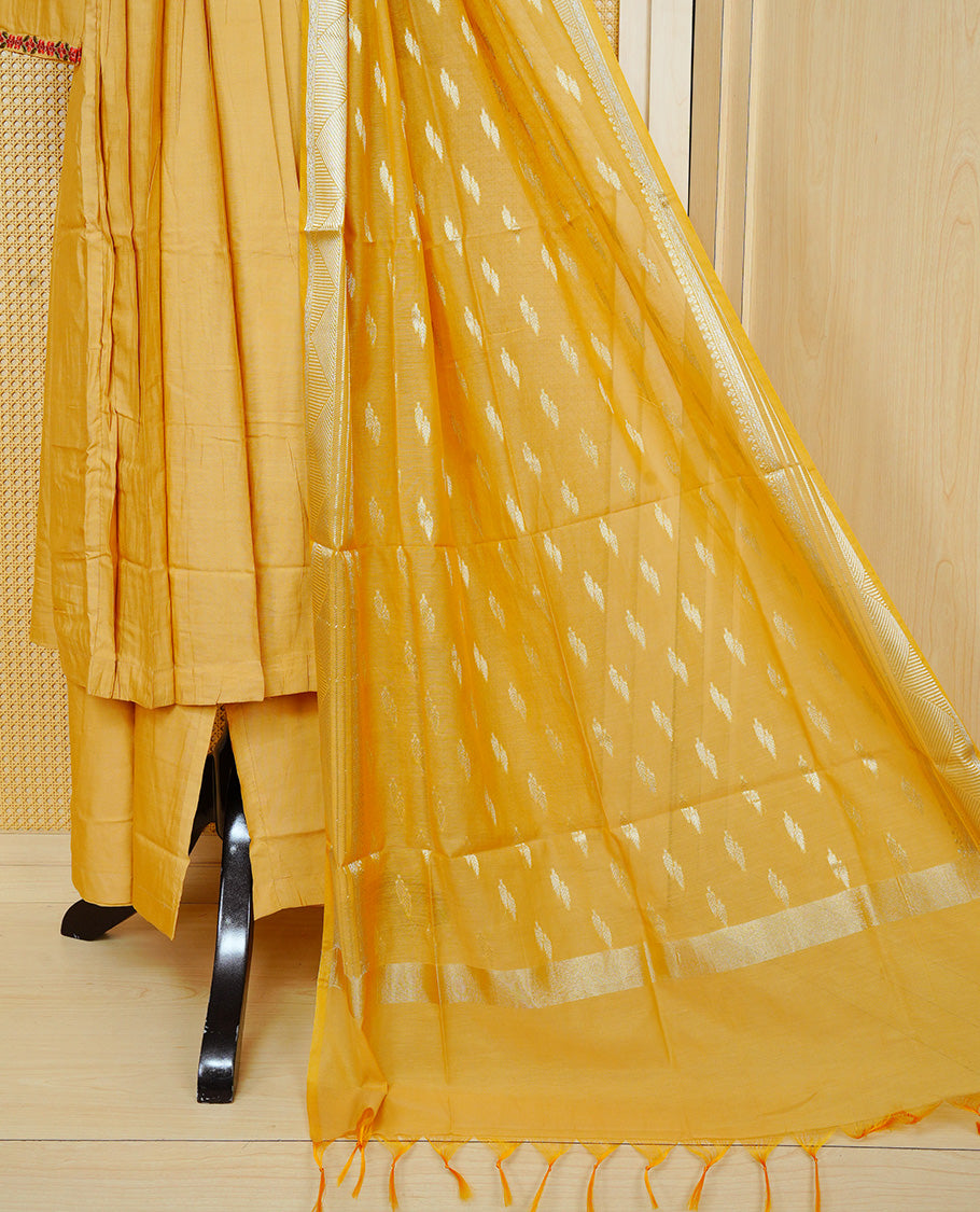 Mustard yellow colour churidar set with floral thread embroidery along the V-neckline and sleeve cuffs, pleated detailing on the front, paired with a matching dupatta and solid pants.