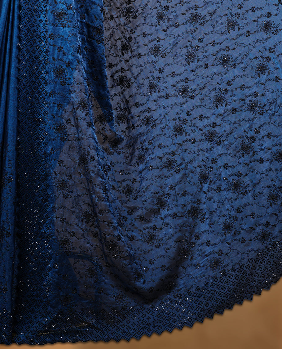 Dark Blue colour velvet chiffon designer saree, featuring black thread embroidery kodi pattern on body, black cut stone work and heavy stone border, pallu and Paired with matching blouse.