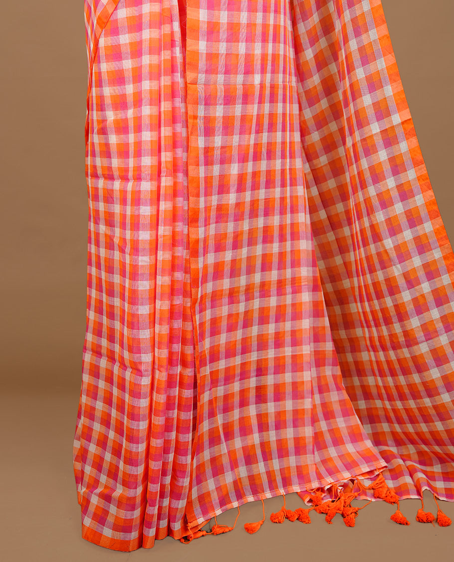 Orange, Pink and White colour Mul Cotton saree featuring a classic Big check pattern on the body, accented with tassels for added charm. Comes without a blouse piece.