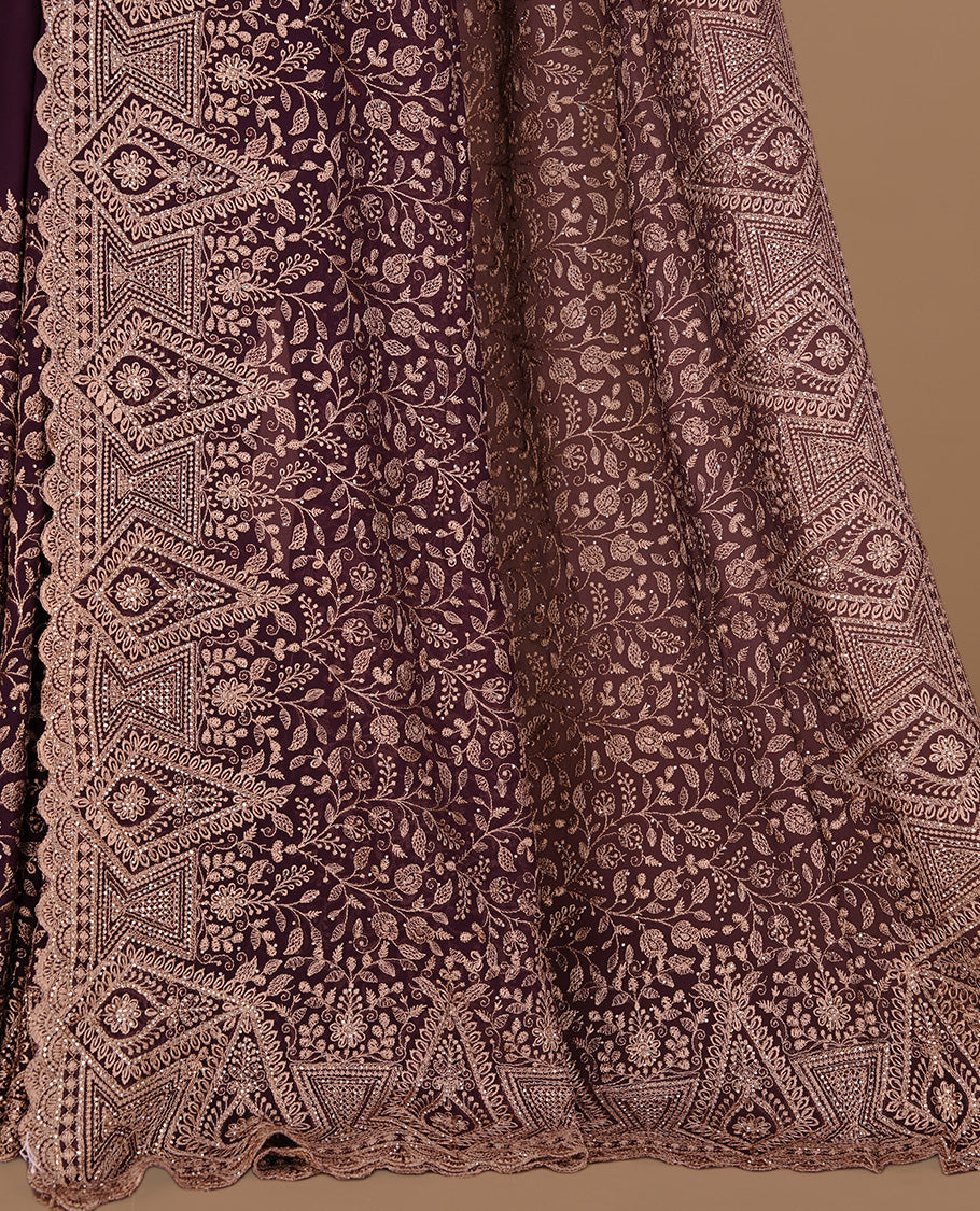 Red colour georgette designer saree featuring Gold thread floral pattern on body highlighting with stone and scalp border, paired with matching blouse piece.