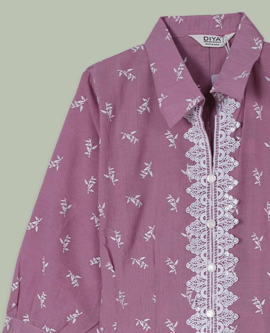 Dusty mauve printed shirt top with collared neckline, three-quarter sleeves, and front lace-trimmed button placket.