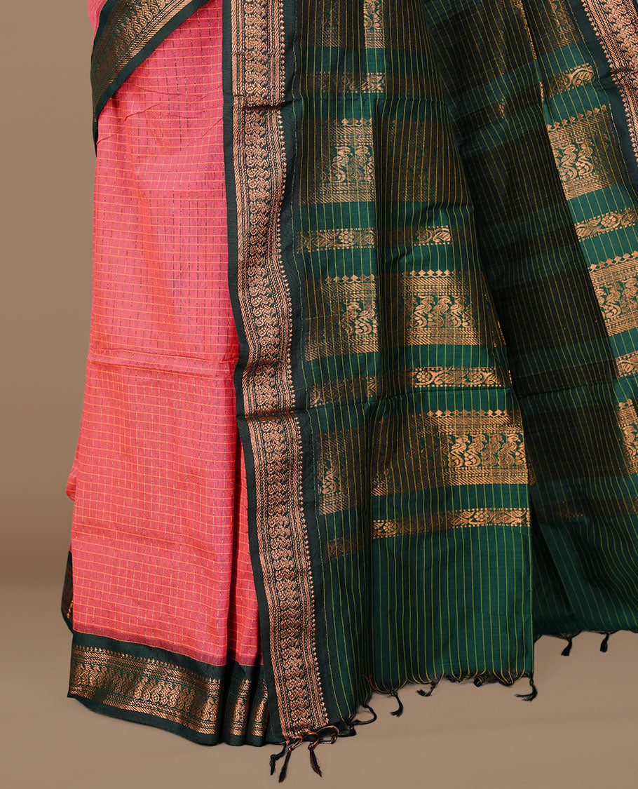 Magenta colour kalyani cotton saree featuring antique zari check pattern on body, complemented by green colour with Antique zari border, paired with matching blouse piece.