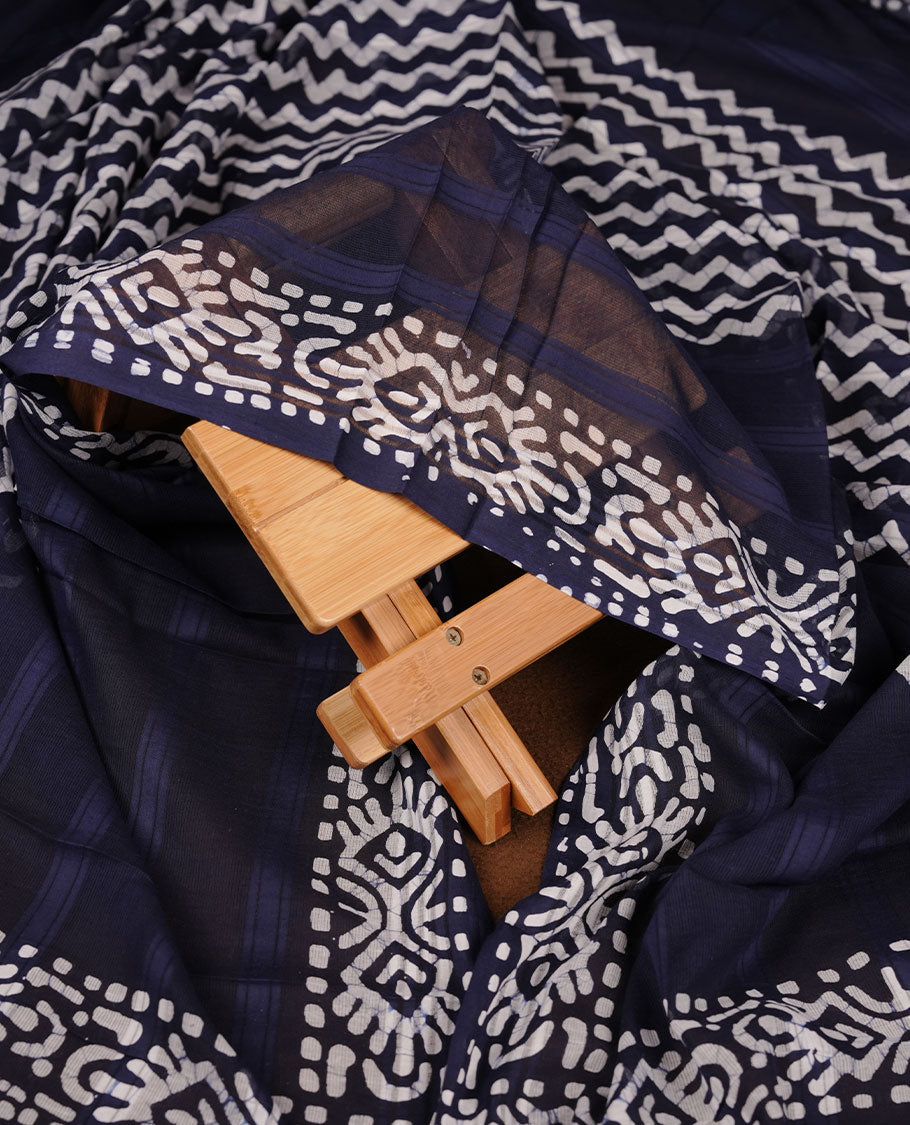 Navy Blue colour churidar material featuring white floral printed body, paired with a matching chevron printed dupatta.