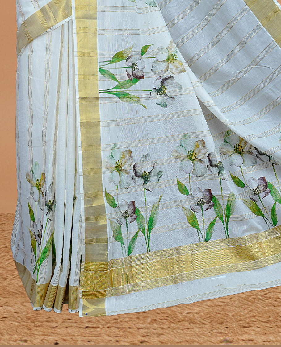 Cream Colour Cotton Kerala Saree Featuring Gold Zari Strips & Floral Printed  Body, Enriched By A Light Gold Zari Border, Paired With A Matching Blouse Piece.