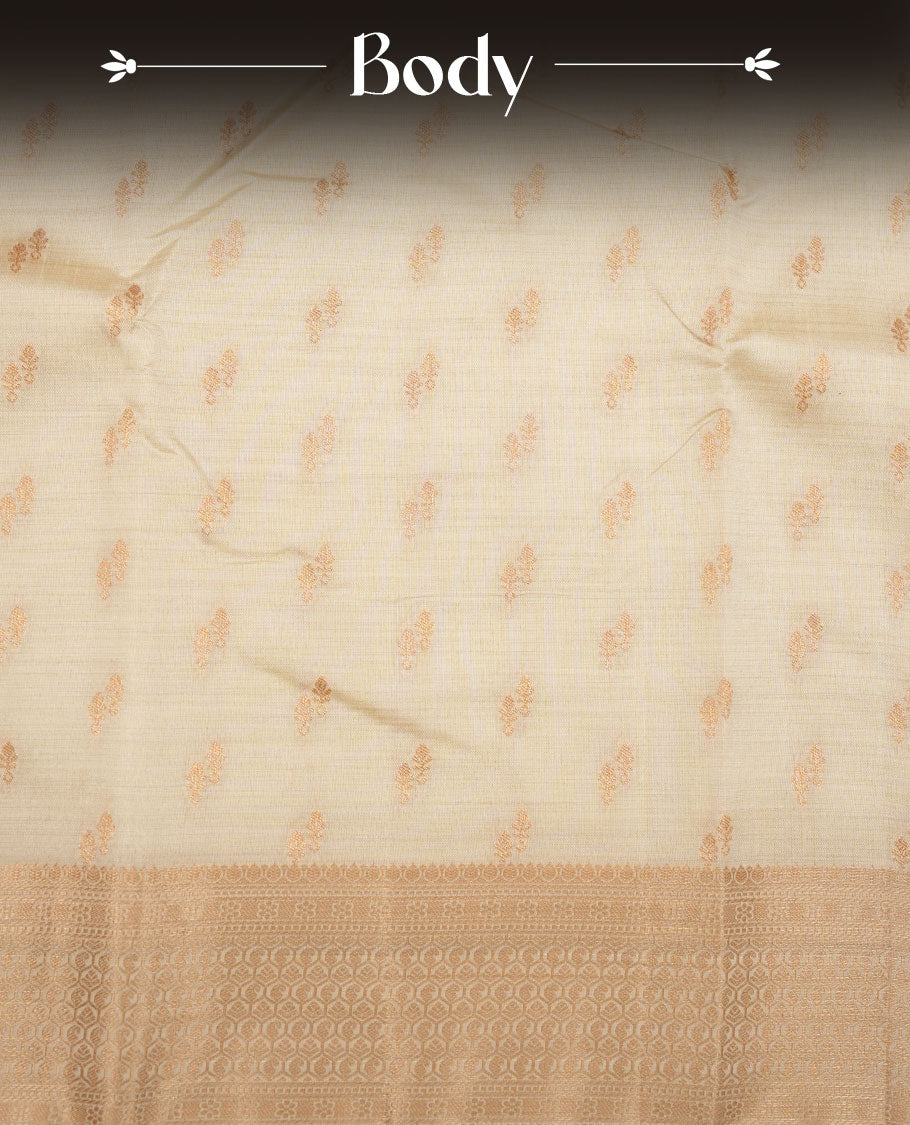 Cream colour tussar saree featuring litte gold zari motifs on body, Self colour border and pallu with zari woven design, comes with matching blouse piece.