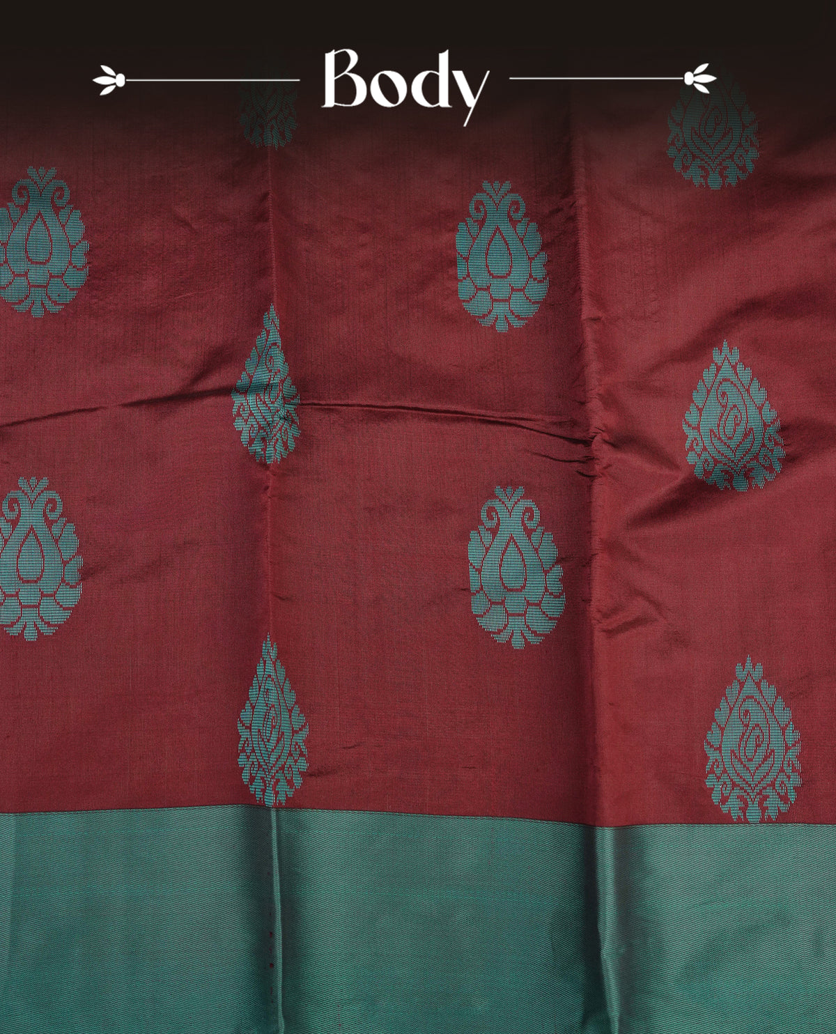 Dark maroon colour silk cotton saree featuring aqua colour thread motifs on body thread detiled contrast borders & pallu, comes with matching blouse piece