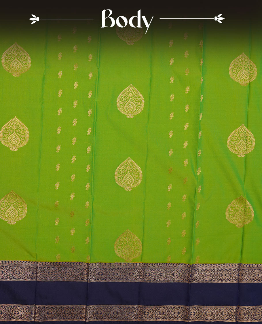 Lemon green colour semi silk saree highlighting gold zari motifs across body, featuring contrast dark blue colour border with gold zari pattern, comes with matching blouse .