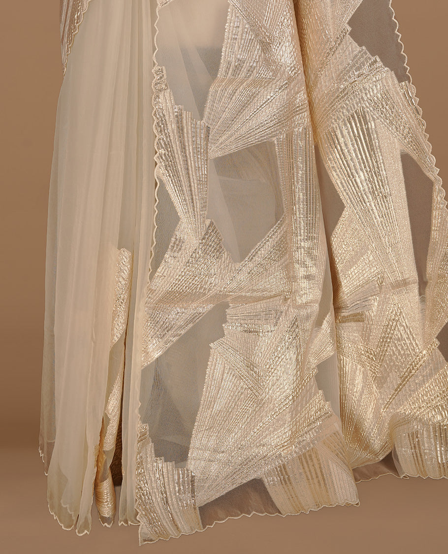 Cream colour pure net organza saree featuring gold geometric pattern on body, featuring scalp designed border, paired with matching blouse piece