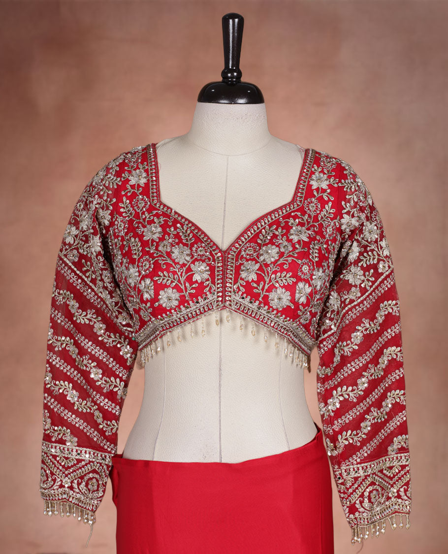 Red Colour net designer Wedding saree featuring all over floral embroidery with sequin detailing and an ornate scalloped border, finished with a matching embellished blouse.