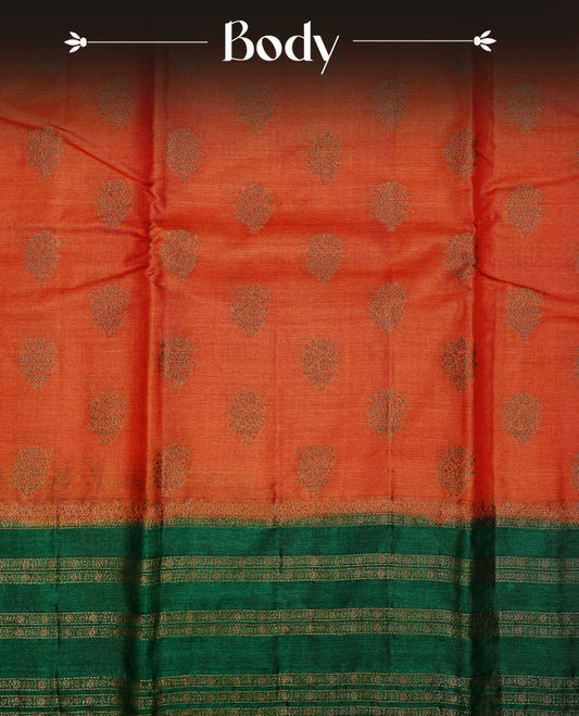 Rust orange colour pure tussar Banaras silk saree featuring elegant gold zari motifs across the body, complemented by a contrast Green border with rich zari detailing. Comes with a matching blouse piece