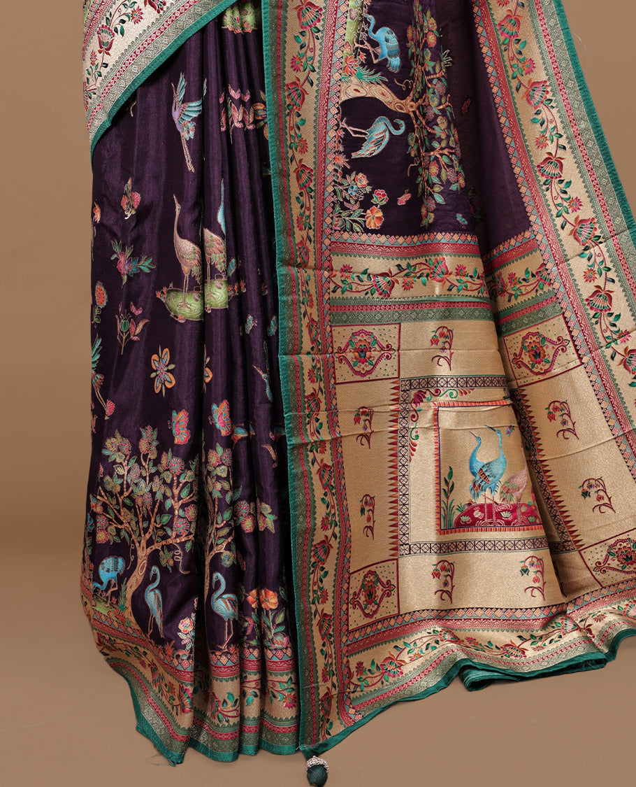 Deep purple colour Pashmina silk saree features an all over forest body, a contrast cream & green floral kodi border and pallu, and a matching unstitched blouse.