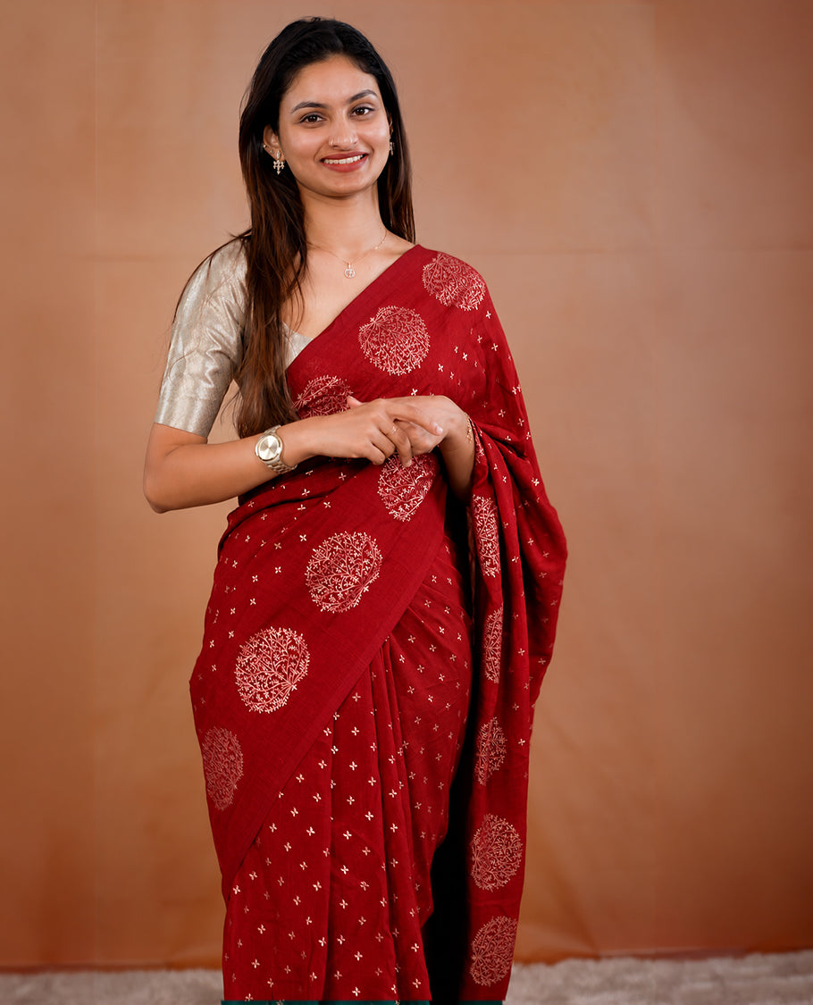 Red colour vijithra silk saree featuring small zari details on body, Tree design border.