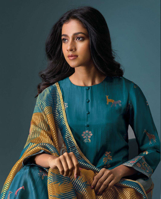 Teal colour suit material with Olivia silk jacquard top featuring elegant digital prints, paired with classic silk bottoms, and completed with a silk jari lining dupatta highlighted by digital prints