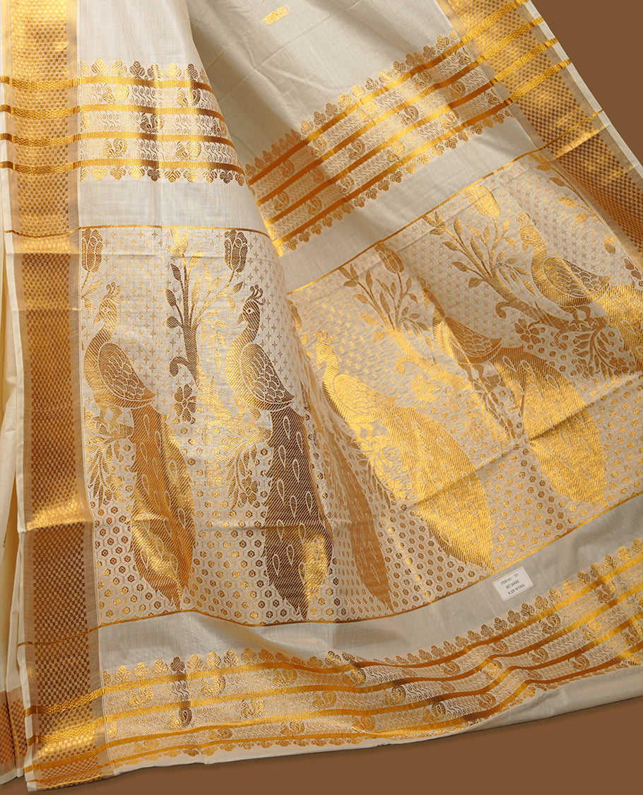 Elegant off white colour cotton Kerala saree with gold zari buttas, broad kasavu border, and richly woven traditional pallu, paired with a matching blouse