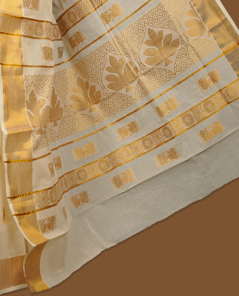 Elegant Off white colour cotton Kerala saree with gold zari buttas, broad kasavu border, and richly woven traditional pallu, paired with a matching blouse