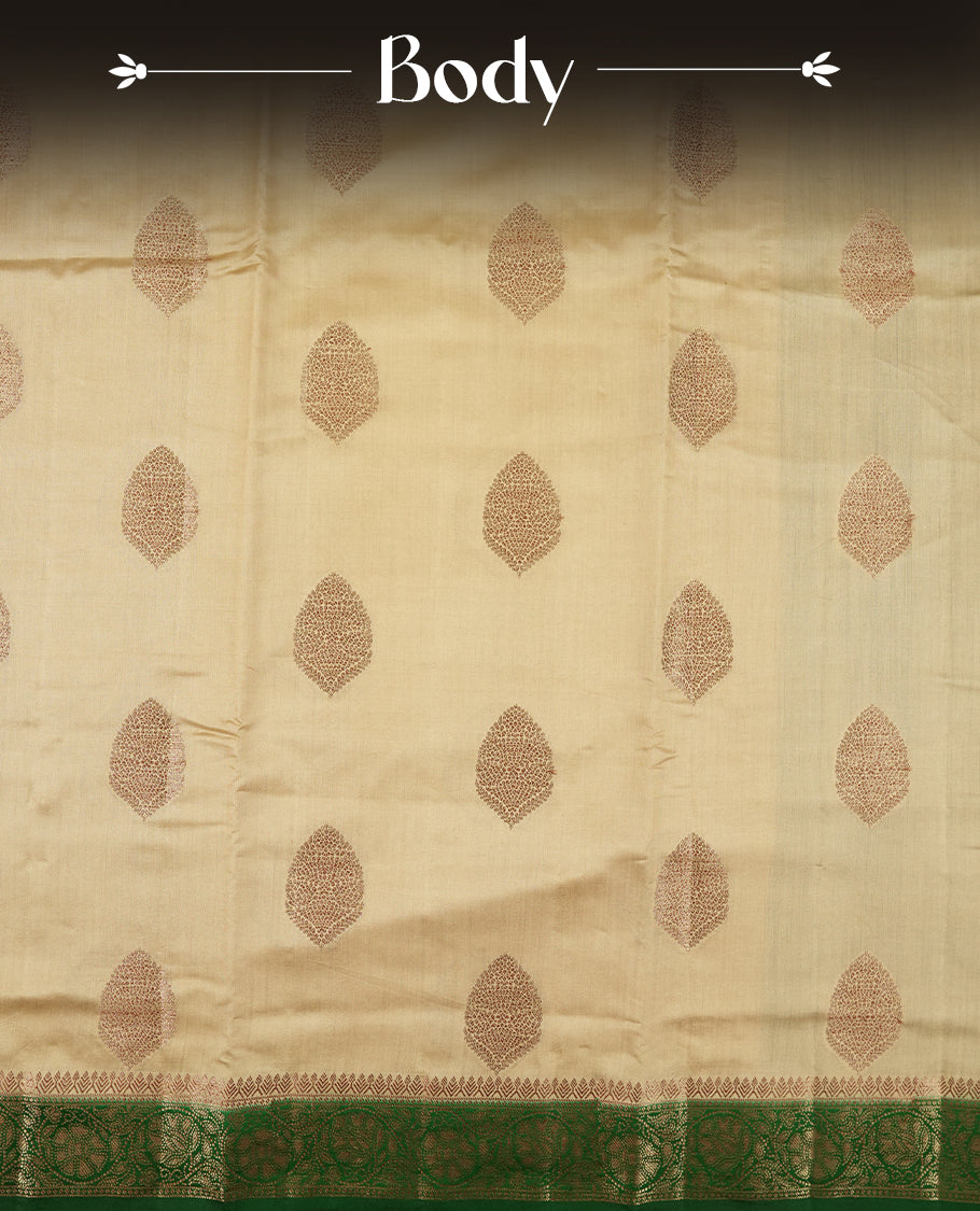 Golden Yellow Colour Banaras Soft Silk Saree with Gold Zari Textured Oval Buttas, Simple Decorative Pallu Border, Pallu with Ornate Floral and Foliate Motifs in Green and Gold Tones, and Matching Forest Green Blouse.