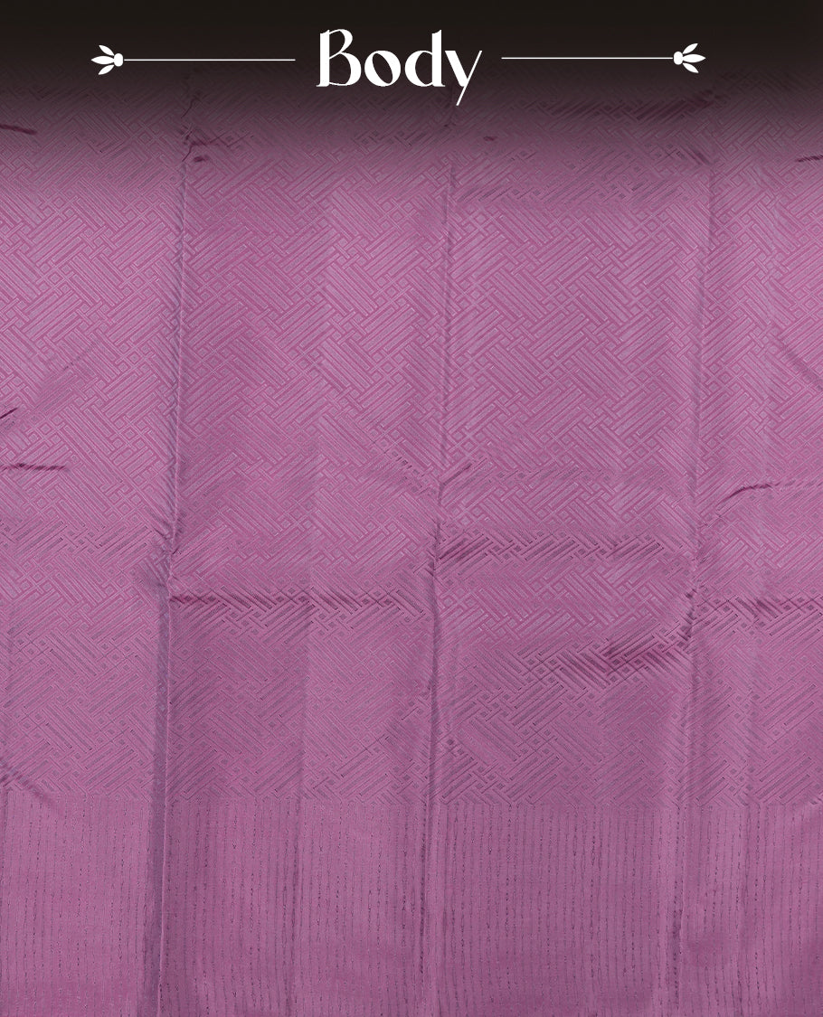 Plum purple colour semi soft silk saree featuring a self coloured textured patterned body, complemented by self coloured pallu & border and a matching blouse piece.