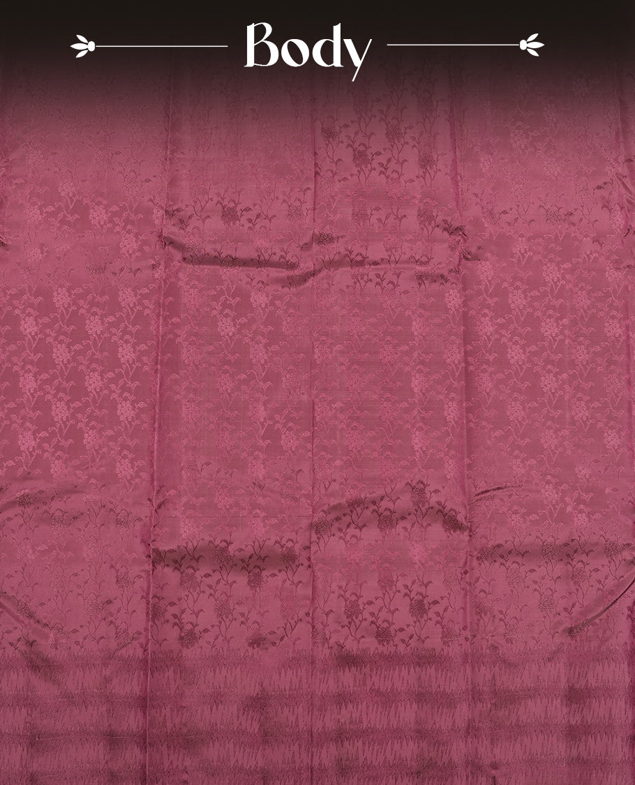 Wine colour semi soft silk saree featuring a self coloured textured patterned body, complemented by self coloured pallu & border and a matching blouse piece.