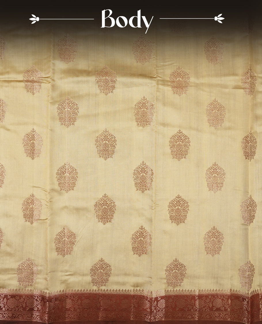Cream Beige Colour Banaras Soft Silk Saree with Gold Zari Mandala Oval Buttas, Intricate Multi-Layered Floral and Foliate Pallu Border, Grand Pallu with Ornate Peacock Motifs in Burgundy and Gold Tones, and Matching Rust Orange Blouse.