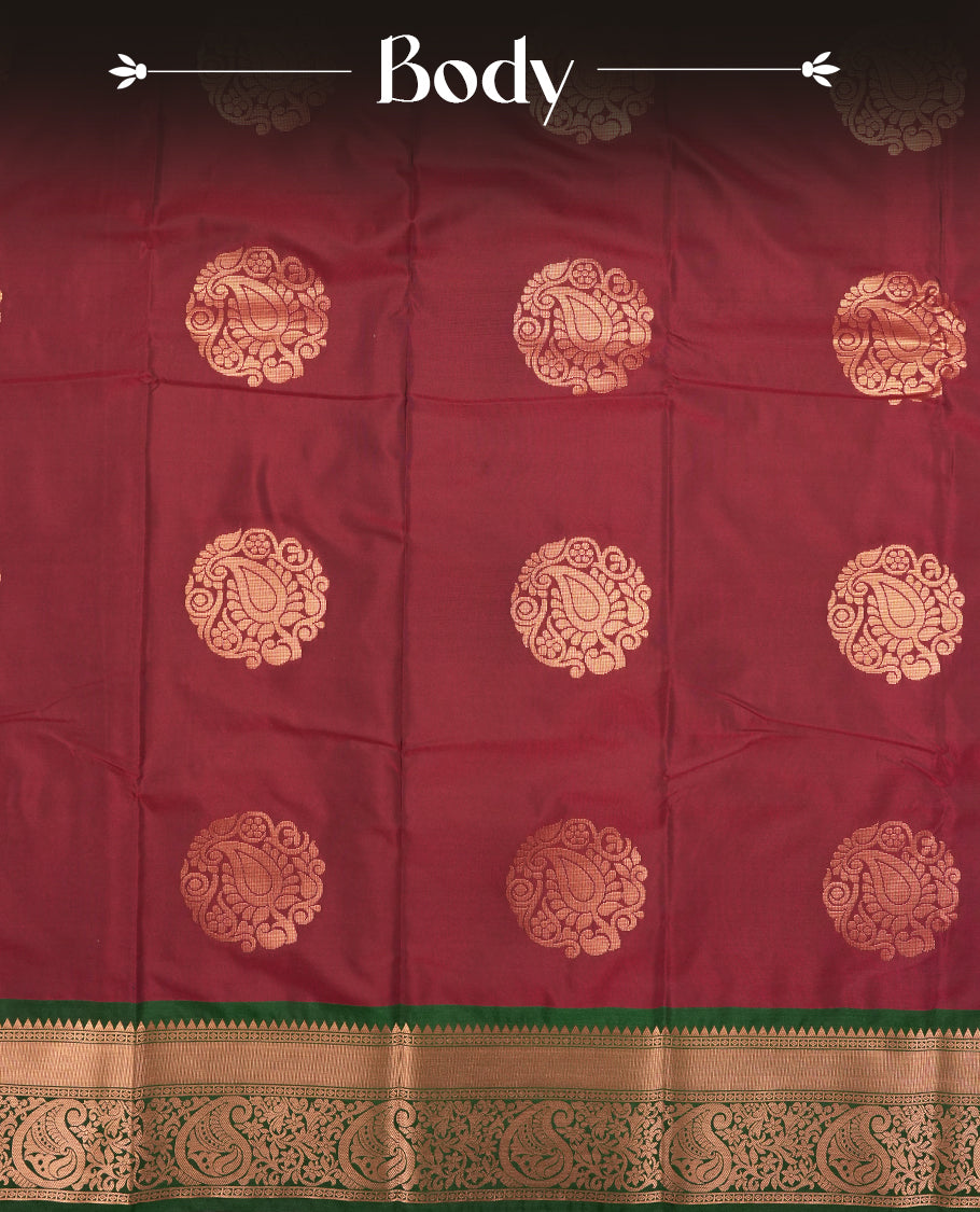 Dark green colour Semi Silk Saree with copper zari motifs on the body, paired with a contrast chocolate brown colour pallu with copper zari traditioal border, and a matching blouse piece.