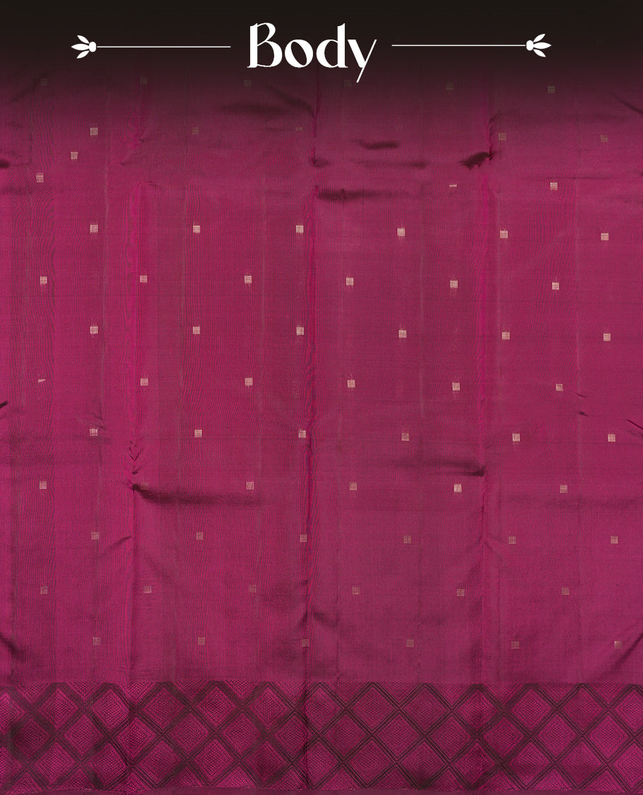 Deep violet colour Vasundhara silk saree adorned with all-over gold square motifs on the body, complemented by a Black & pink colour zigzag border and paired with a matching blouse piece.