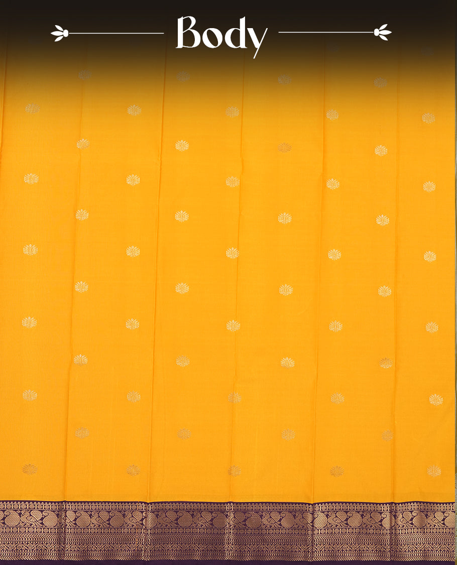 Yellow colour Semi Silk Saree with gold zari striped patterns on the body, paired with a contrasting dark purple colour traditional pallu and border, and a matching blouse piece.