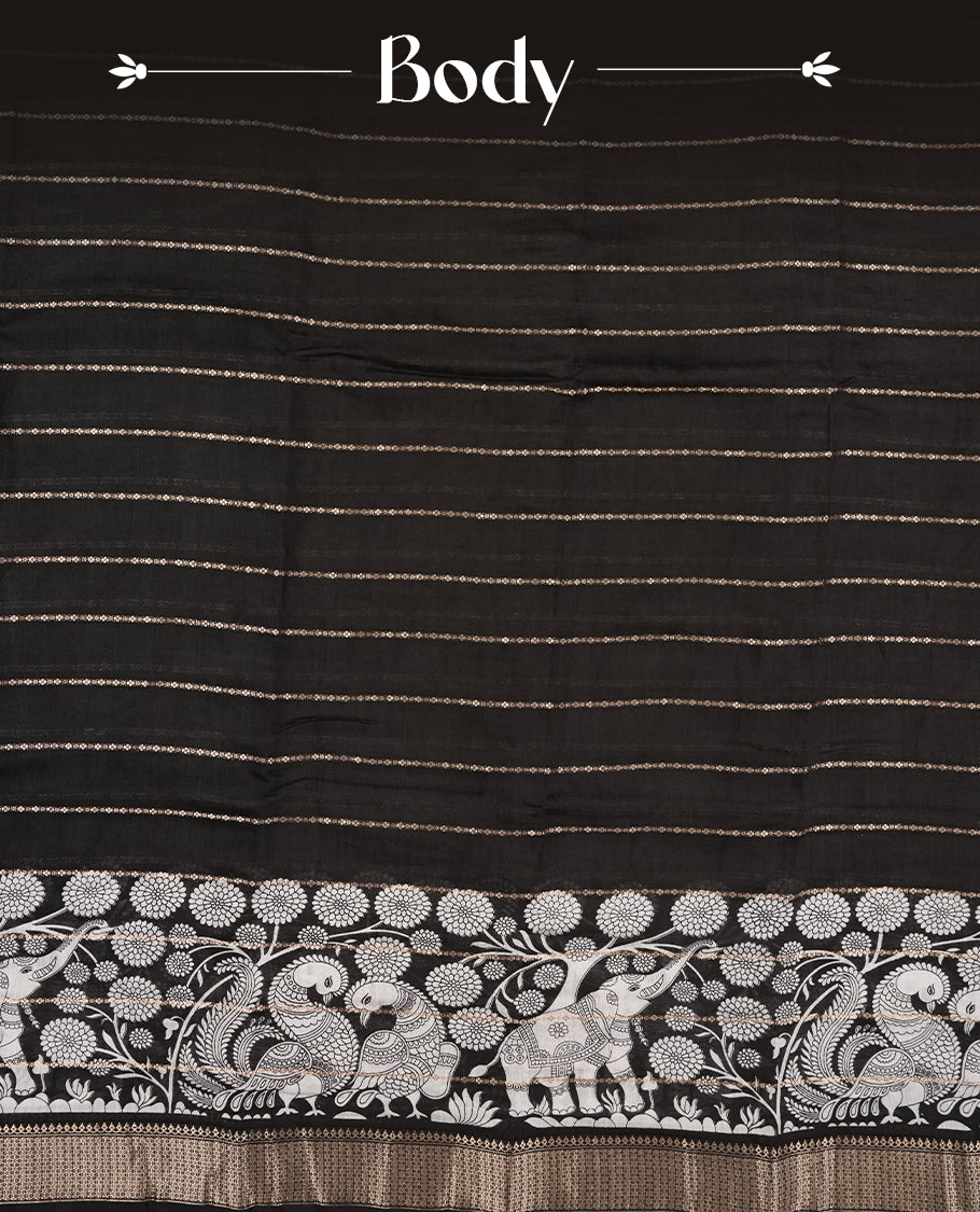 Black colour chanderi silk saree with gold zari strip pattern On body, compilmented by self colour border with antique zari pattern & white animal & forest print pattern and a matching blouse.
