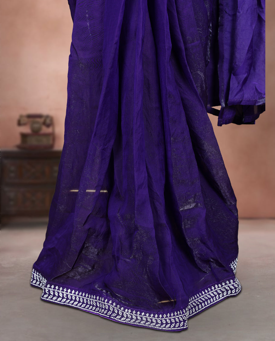 Elegant Dark purple colour ready to wear saree adorned with rich silver stone embroidery along the border and pallu, paired with a heavily embellished matching blouse for a grand festive look.