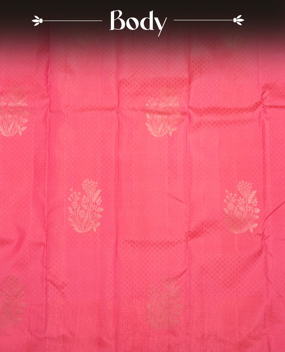 Pink colour Vasundhara silk saree adorned with all-over tiny motifs on the body, complemented by a self colour with self coloured with gold flower pattern on border and paired with a matching blouse piece.