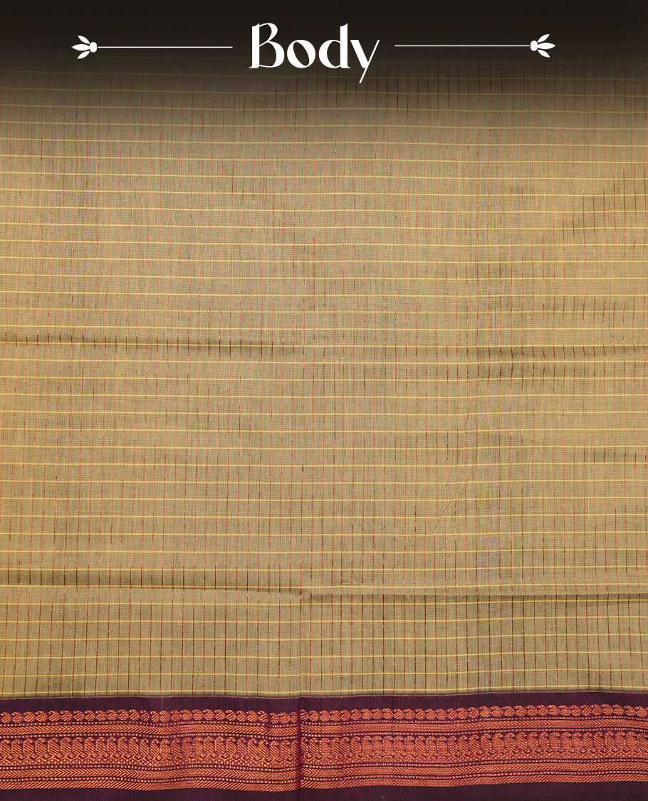 Khaki coloured mixed Kalyani cotton saree featuring copper zari checks on the body, complemented by a rich grape coloured border and pallu adorned with copper zari patterns, Paired with a matching blouse.