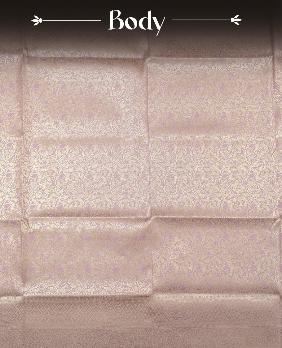 Lavender colour semi soft silk saree featuring an all-over woven leaf pattern in gold colour , finished with a matching border adorned with detailed paisley and floral motifs, and a matching blouse piece.