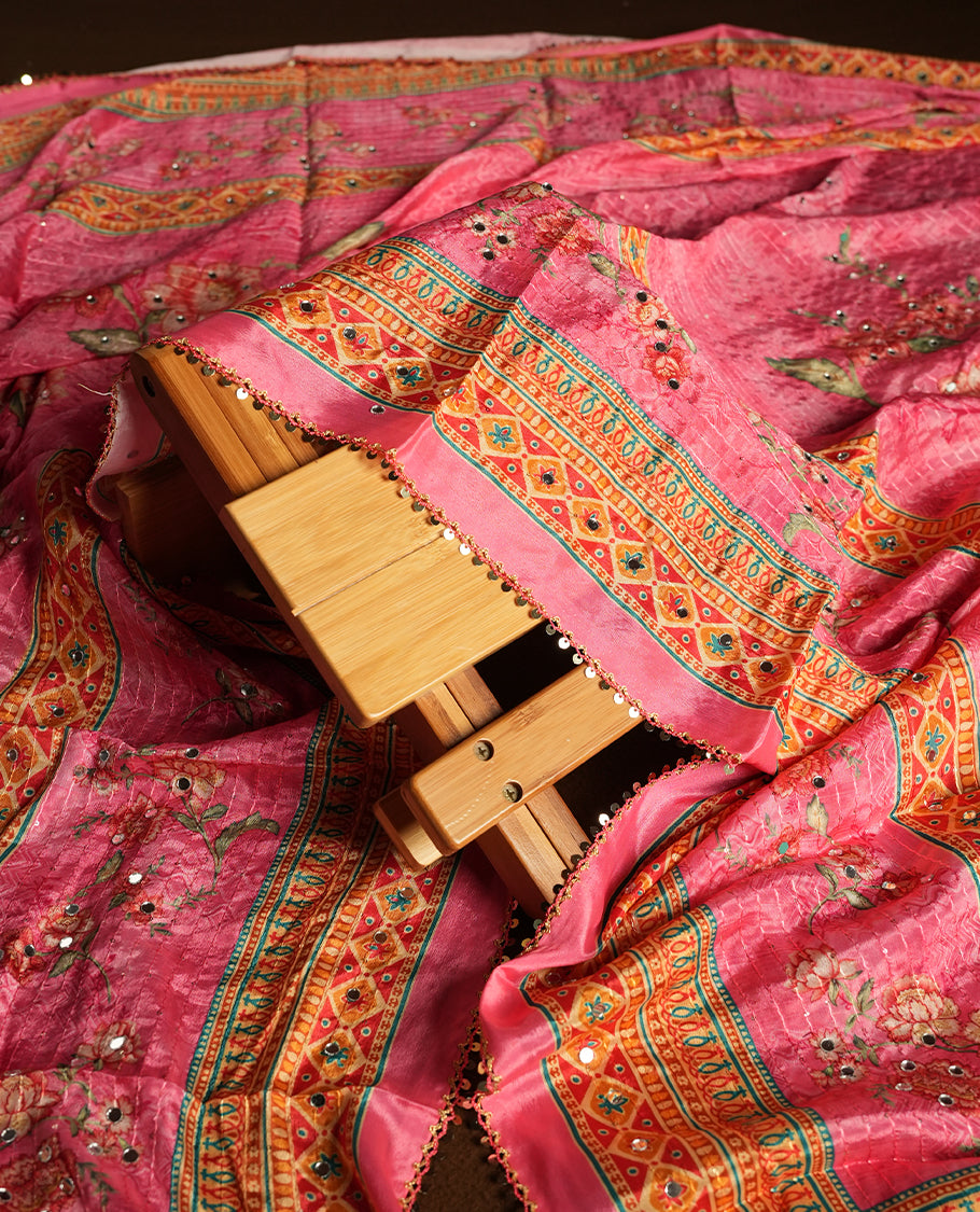 White colour churidhar material featuring Mirror and thread embroidery, foral print pattern on the contrast Pink colour front panel, floral digital printed dupatta with elegant border, and matching plain bottom