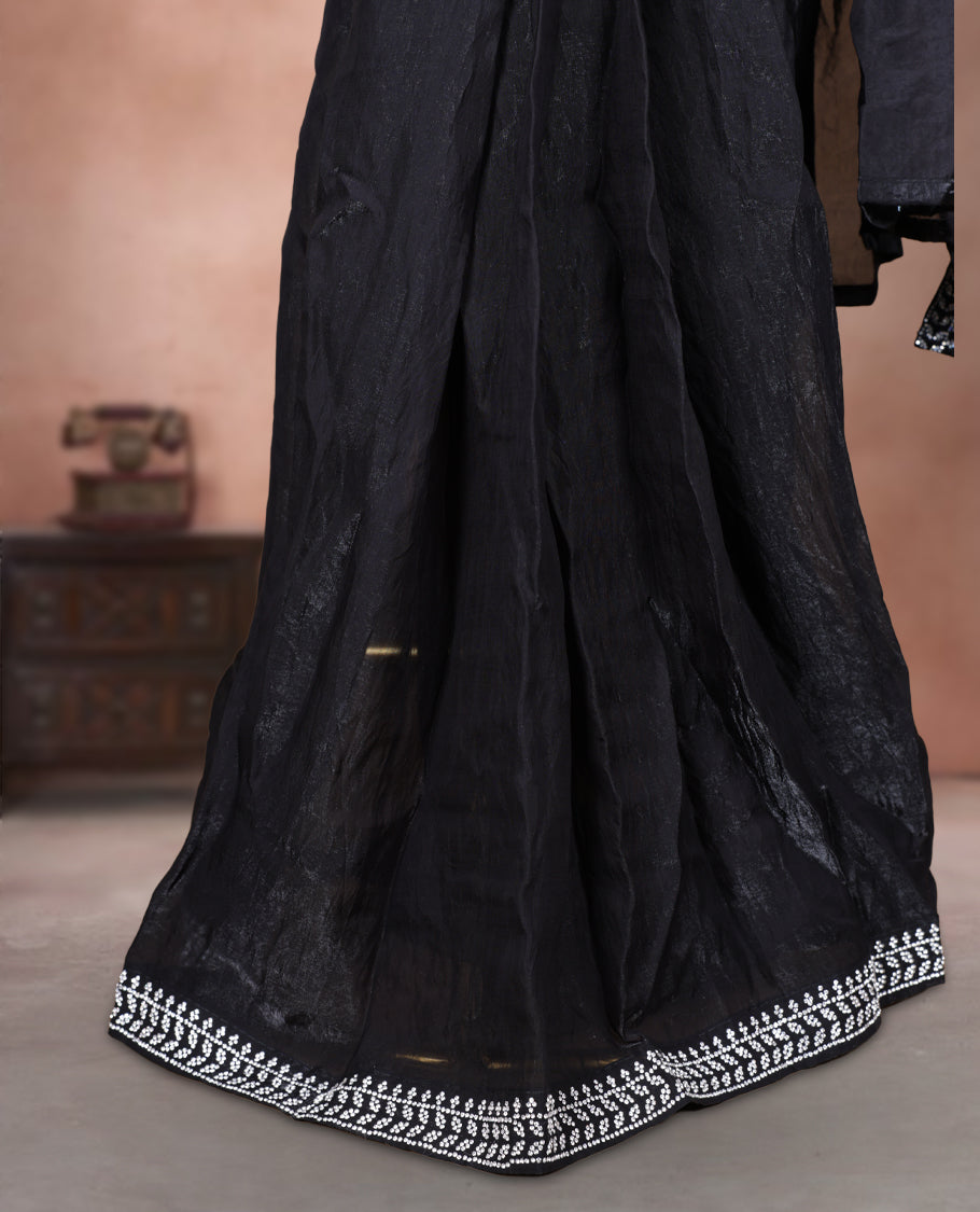 Elegant Black colour ready to wear saree adorned with rich silver stone embroidery along the border and pallu, paired with a heavily embellished matching blouse for a grand festive look.