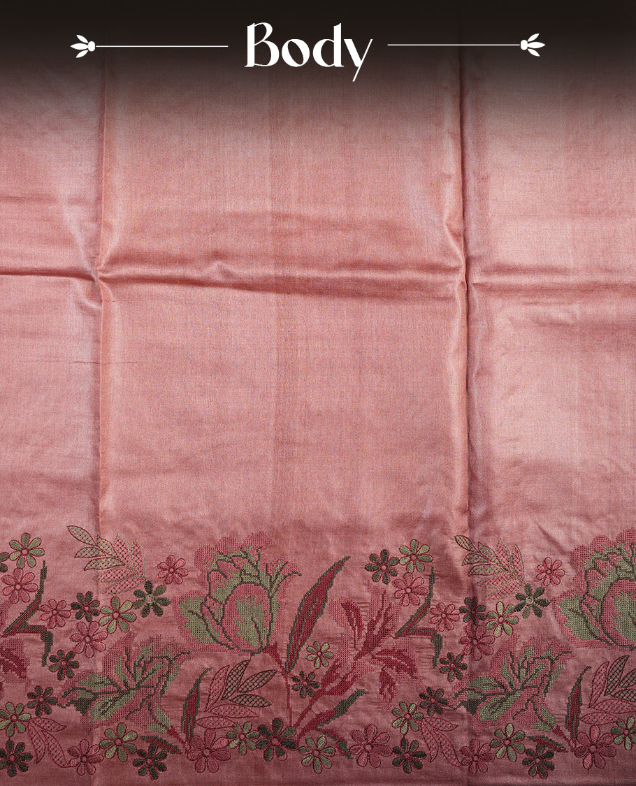 Pastel peach colour Pure tusser silk saree featuring finely crafted floral thread embroidery detailing on the border, pallu and with matching blouse piece.