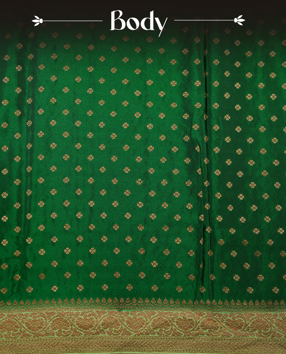 Dark Green colour pure Banarasi georgette saree featuring gold zari Flower Motifs all over the body, complemented by an contrast Light green dye colour with gold zari Floral Kodi Worked border and pallu, with matching blouse.