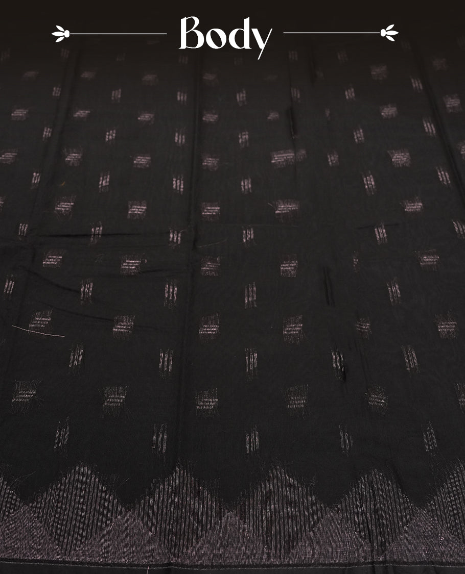 Black Silk Cotton Saree with Silver Butta Body and Ornamental Leaf Motif, Featuring Decorative Scalloped Silver Zari Border on Grand Pallu, Paired with Matching Plain Black Blouse Piece