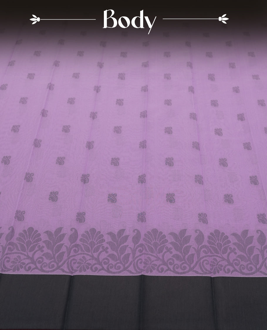 Lavender colour silk cotton saree featuring elegant floral zari motifs on the body, complemented by a rich contrast dark grey border and pallu with traditional woven detailing & Comes with a matching blouse piece.