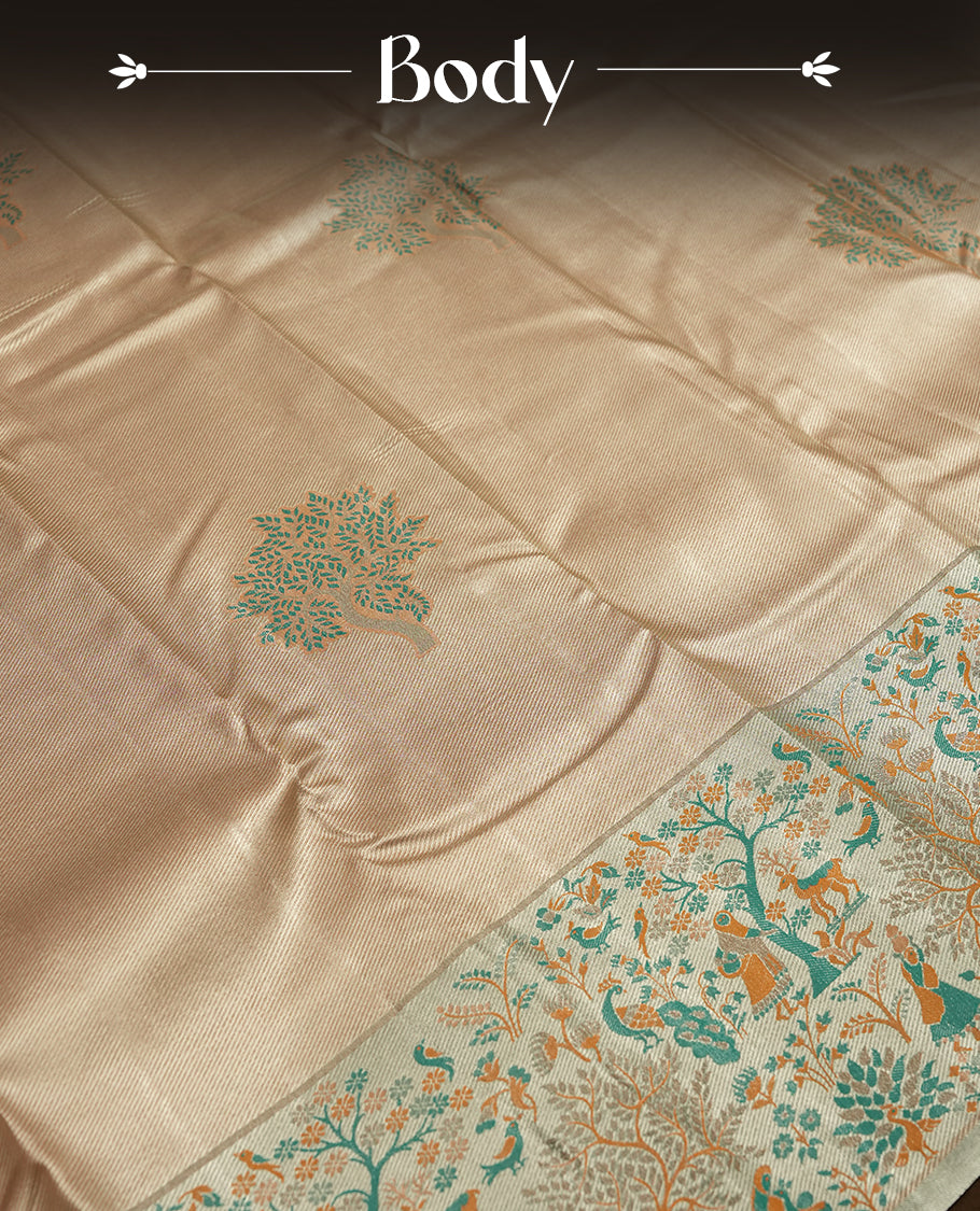 Golden colour Zari Tissue Brocade Saree features intricate tree Motifs on body and fancy border & pallu with floral patterns, paired with matching blouse