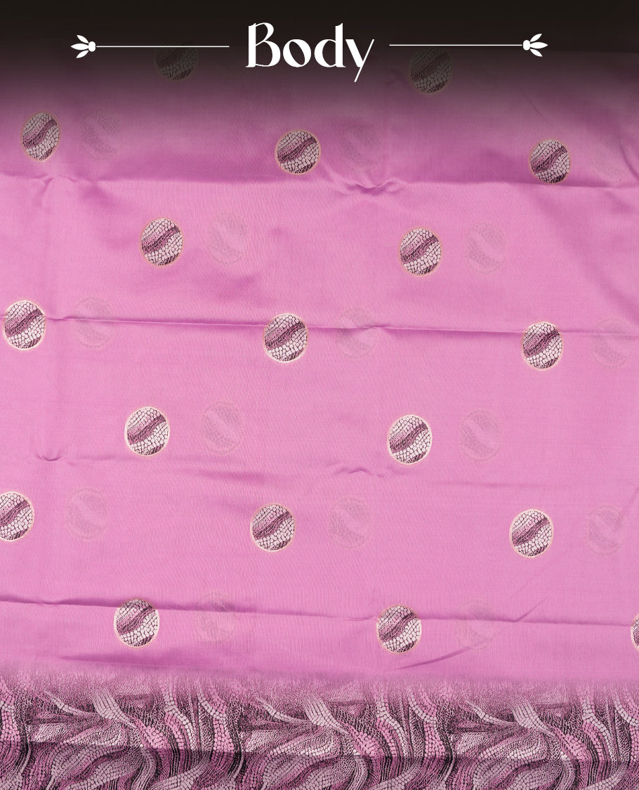 pink semi silk saree featuring elegant circular motifs on the body, complemented by a striking pallu adorned with intricate wavy white thread patterns with golden border, and paired with a matching blouse