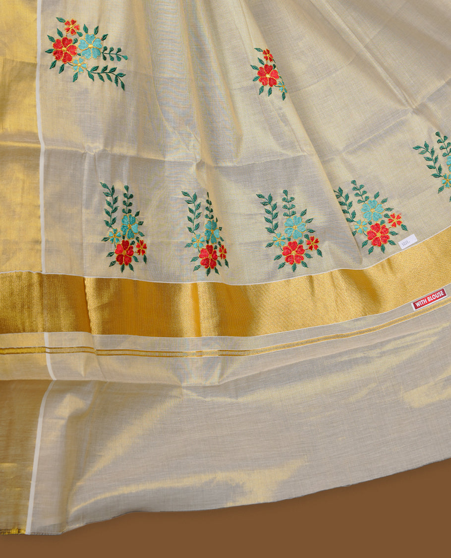 Off-white Kerala kasavu saree with delicate floral embroidery, finished with a classic gold border and paired with a matching blouse.