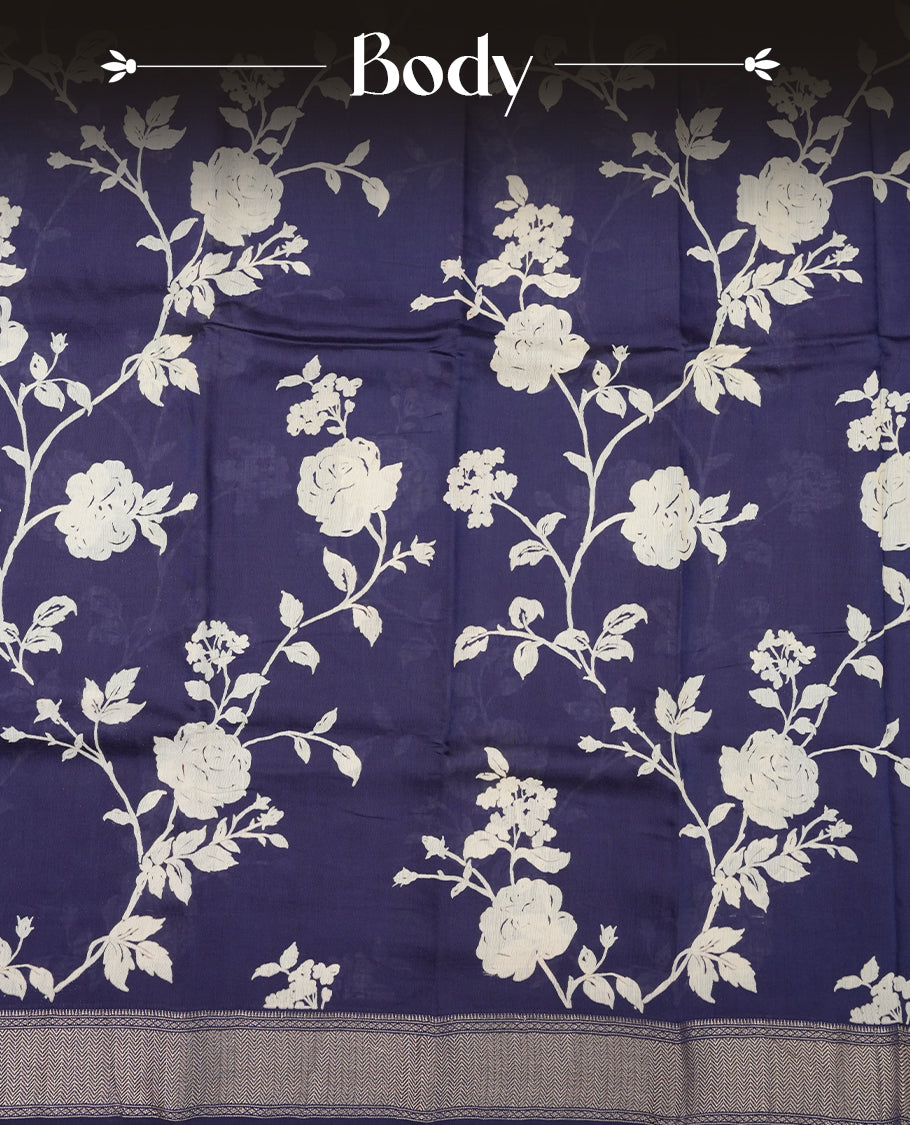 Dark blue colour Viscos semi printed saree featuring a light golden zari border, abstract Off white printed motifs on the body, and comes with a matching blouse