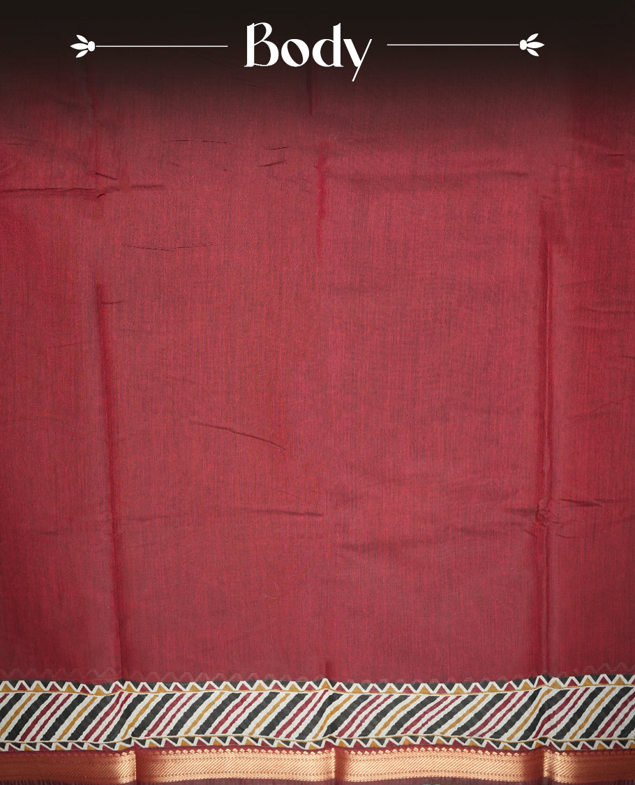 Maroon colour chanderi cotton saree with plain body, geometric tribal printed pallu with golden zari border, and diagonal striped blouse.