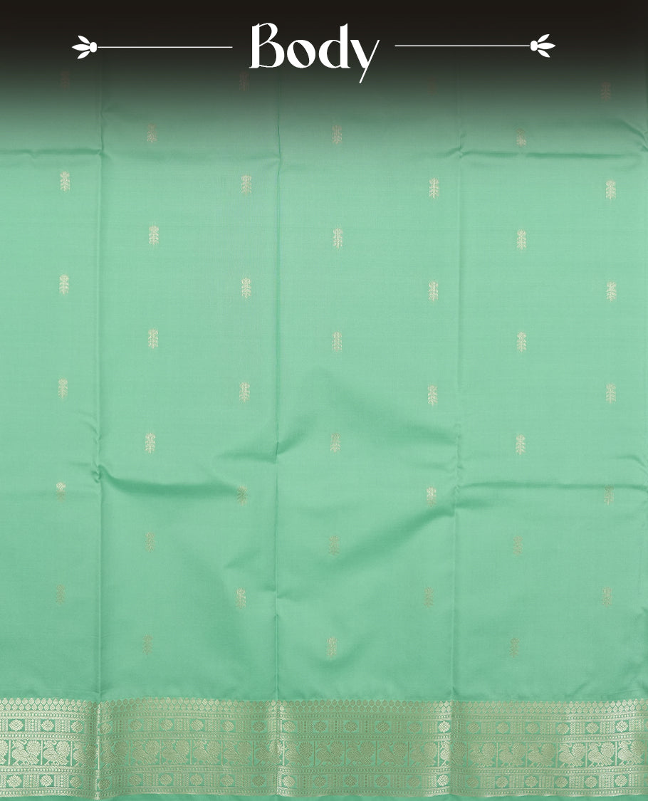 Light aqua colour semi soft silk saree featuring a gold patterned body, complemented by Gold colour traditional pallu and a matching blouse piece.