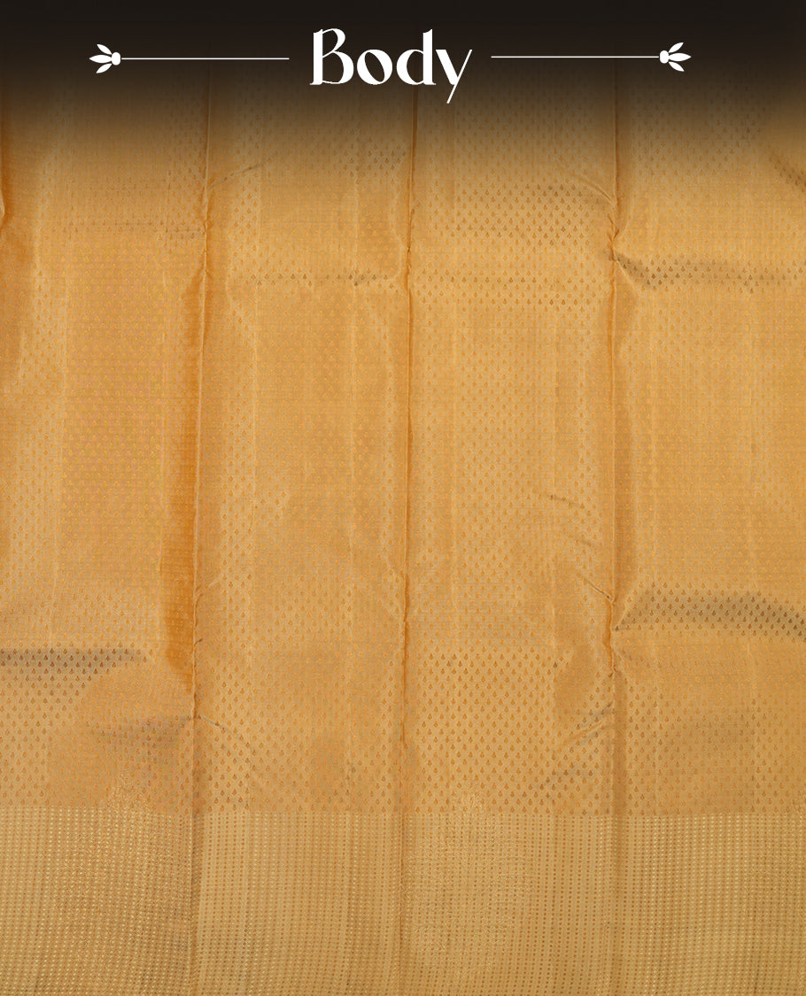 Muted Brown colour Vasundhara silk saree adorned with all-over self coloured motifs on the body, complemented by a self coloured with tiny daimond pattern with gold tree motifs border and paired with a matching blouse piece.