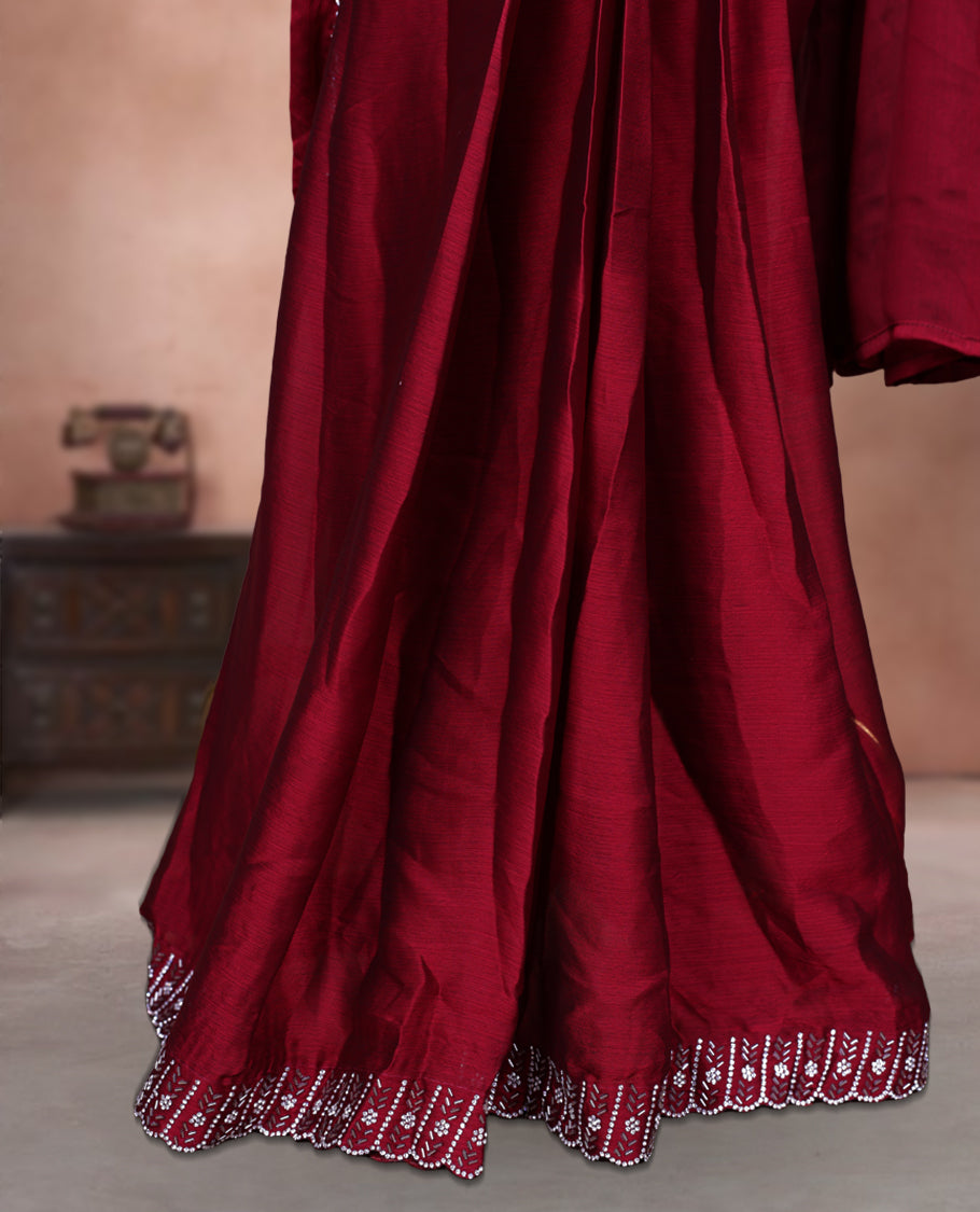 Elegant Dark red colour ready to wear saree adorned with rich White stone and bead embroidery along the border and pallu, paired with a heavily embellished matching blouse for a grand festive look.