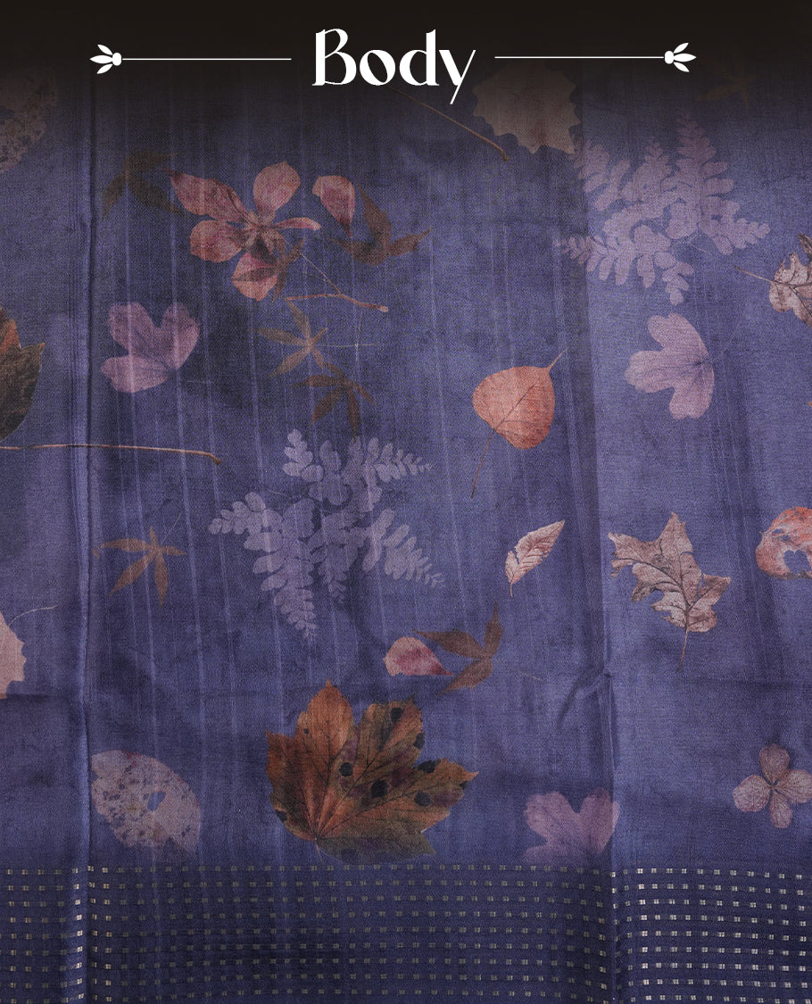 Dark blue colour tussar saree featuring woven Eco leaves printed on the body, complemented by a self colour gold zari bindi butta border & pallu, paired with a matching blouse.