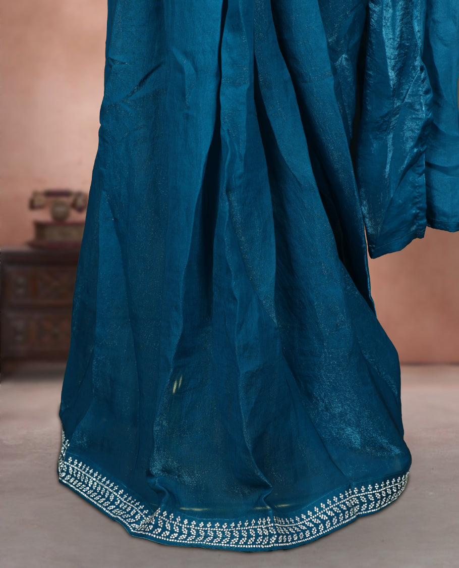 Elegant Aqua blue colour ready to wear saree adorned with rich white stone embroidery along the border and pallu, paired with a heavily embellished matching blouse for a grand festive look.
