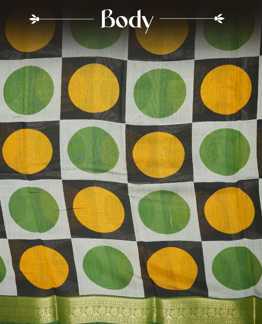 Multicolor mixed chanderi cotton saree with mustard-yellow and green circles on black and off-white checkerboard squares, green and golden zari pallu with polka dots and floral motifs, and matching green blouse.